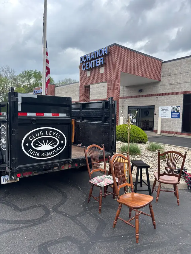 A Club Level Cleaning trailer dropping off donated items at a Goodwill donation centre