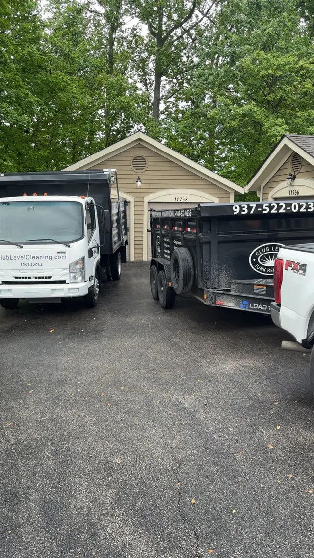 Club Level Cleaning's own trucks and trailer parked in Dayton, OH